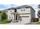 Charming two-story home featuring manicured landscaping and a spacious two-car garage at 244 Chipeta Way, Lochbuie, CO 80603