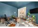 Office space with a wooden desk, office chair, and stylish decor plus a view to an open hallway at 244 Chipeta Way, Lochbuie, CO 80603