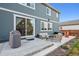 Outdoor patio with stylish seating, a grill, and an inviting entertainment space at 11783 Niagara St, Thornton, CO 80233