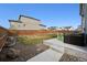 A well-maintained backyard featuring a hot tub and a concrete patio, perfect for outdoor enjoyment at 11783 Niagara St, Thornton, CO 80233