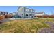 Spacious backyard with a concrete patio, shed, and fire pit area, offering room for activities at 11783 Niagara St, Thornton, CO 80233