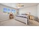 Cozy bedroom featuring a comfortable bed, large windows, and coordinated furnishings at 11783 Niagara St, Thornton, CO 80233