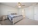 Bright bedroom features a neutral palette, lots of light, and a comfortable bed at 11783 Niagara St, Thornton, CO 80233