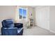 Comfortable Bedroom with a cozy armchair and a view from the bright window at 11783 Niagara St, Thornton, CO 80233