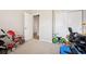 Neutral-toned bedroom provides ample space, making it perfect for a play area at 11783 Niagara St, Thornton, CO 80233