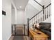 Hallway with -proofed gate leads to stairs, showcasing a comfortable, inviting home at 11783 Niagara St, Thornton, CO 80233