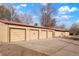 View of the four-car detached garage with alley access and lots of parking space at 2695 S Josephine St, Denver, CO 80210