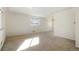 Bright living room featuring carpet flooring, fresh paint, and natural light at 2695 S Josephine St, Denver, CO 80210