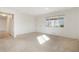 Bright living room with a large window allowing for natural light, and fresh paint at 2695 S Josephine St, Denver, CO 80210