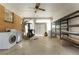 Spacious sunroom with ceiling fan, shelving, and exercise equipment with access to laundry machines at 2695 S Josephine St, Denver, CO 80210