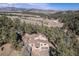 Expansive aerial view shows a home surrounded by trees with mountain views and a detached two-car garage at 268 Cedar Rd, Golden, CO 80401