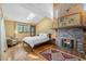 Cozy bedroom with skylight, hardwood floors, fireplace and natural light at 268 Cedar Rd, Golden, CO 80401