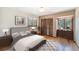 Comfortable bedroom featuring a large bed, windows with natural light, and closet at 268 Cedar Rd, Golden, CO 80401