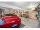 Spacious garage with an electric car, tool storage, and work space at 268 Cedar Rd, Golden, CO 80401