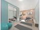 Home gym featuring a treadmill, weights, mirrors, and exercise equipment at 268 Cedar Rd, Golden, CO 80401