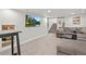Finished basement with a cozy seating area, TV, and stairway access at 3241 Sheridan Blvd, Wheat Ridge, CO 80212