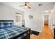 Bedroom with hardwood floors, natural light, and charming wood decor at 3241 Sheridan Blvd, Wheat Ridge, CO 80212