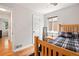 Bedroom showcasing hardwood floors, natural light, and inviting decor at 3241 Sheridan Blvd, Wheat Ridge, CO 80212