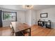 Open dining area featuring hardwood floors and natural light at 3241 Sheridan Blvd, Wheat Ridge, CO 80212