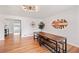 Bright dining area featuring hardwood floors and modern lighting at 3241 Sheridan Blvd, Wheat Ridge, CO 80212