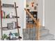 Welcoming entryway with staircase, decorative shelves, and charming details at 3241 Sheridan Blvd, Wheat Ridge, CO 80212