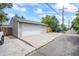Garage exterior showing a large driveway, a modern garage door, and house number 3241 at 3241 Sheridan Blvd, Wheat Ridge, CO 80212