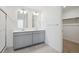 Bathroom with double sinks, gray cabinets and shower stall at 3226 Belleville Ridge Rd, Elizabeth, CO 80107