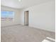 Bedroom with carpet flooring, a window, and a door, bathed in natural light at 3226 Belleville Ridge Rd, Elizabeth, CO 80107