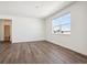 Bright bedroom with a large window offering a pleasant view and vinyl wood flooring at 3226 Belleville Ridge Rd, Elizabeth, CO 80107