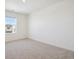 Light-filled bedroom with plush carpeting and a window offering a view at 3226 Belleville Ridge Rd, Elizabeth, CO 80107