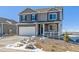 Charming two-story home features a large driveway, two-car garage, and covered front porch at 3226 Belleville Ridge Rd, Elizabeth, CO 80107