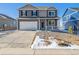 Charming two-story home features a large driveway, two-car garage, and covered front porch at 3226 Belleville Ridge Rd, Elizabeth, CO 80107