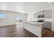 Modern kitchen features a center island, stainless steel appliances, and gray cabinets at 3226 Belleville Ridge Rd, Elizabeth, CO 80107