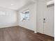 Bright living room with beautiful hardwood floors and a large window allowing for natural light at 3226 Belleville Ridge Rd, Elizabeth, CO 80107
