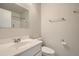 Bathroom with white vanity, a mirror and white tiled shower and bath at 8643 Carr Loop, Westminster, CO 80005
