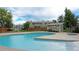 Community pool with lounge chairs and well maintained surrounding landscape at 8643 Carr Loop, Westminster, CO 80005