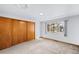 Bright bedroom with neutral carpet, a window with natural light, and a closet at 3131 S Washington St, Englewood, CO 80113