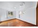 Bedroom with hardwood floors and two windows offering plenty of natural light at 3131 S Washington St, Englewood, CO 80113