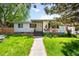 Charming single-story home with a well-manicured lawn and inviting walkway at 3131 S Washington St, Englewood, CO 80113