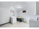 Functional laundry room with washer, dryer, and folding table with lots of natural light at 3131 S Washington St, Englewood, CO 80113