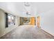 Bright living room with neutral carpet, ceiling fan, and large windows at 3131 S Washington St, Englewood, CO 80113