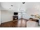 Cozy living room features a fireplace, dark wood floors, and a ceiling fan at 3131 S Washington St, Englewood, CO 80113