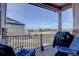 Relaxing back deck area with comfortable seating, grill, and peaceful views at 24963 E Phillips Pl, Aurora, CO 80016