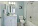 Well-lit bathroom with a white vanity, framed mirror, and shower-tub combination at 24963 E Phillips Pl, Aurora, CO 80016