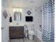 Bathroom featuring vanity, sink, toilet, tub and shower combination with decorative curtain at 24963 E Phillips Pl, Aurora, CO 80016