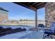 Outdoor patio with stone detail and views of the fenced in yard and neighborhood at 24963 E Phillips Pl, Aurora, CO 80016