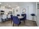 Open-concept dining area featuring a modern table and seamless kitchen access at 24963 E Phillips Pl, Aurora, CO 80016