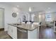 Modern kitchen with sleek countertops, stainless steel appliances, and open layout at 24963 E Phillips Pl, Aurora, CO 80016