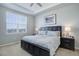 Comfortable main bedroom with a king-size bed, and ample natural light from a large window at 24963 E Phillips Pl, Aurora, CO 80016