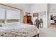 Bedroom with a large window, dresser, and floral bedding that offers relaxing views at 1585 Hecla Way # 304, Louisville, CO 80027
